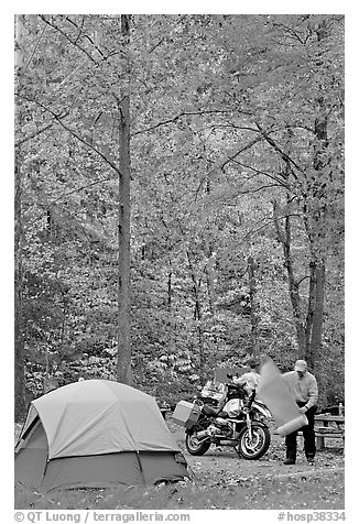 Tent and motorcycle camper under trees in fall colors. Hot Springs National Park (black and white)