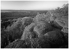 Mount Franklin granite outcrop and distant Lake Superior at sunset. Isle Royale National Park, Michigan, USA. (black and white)