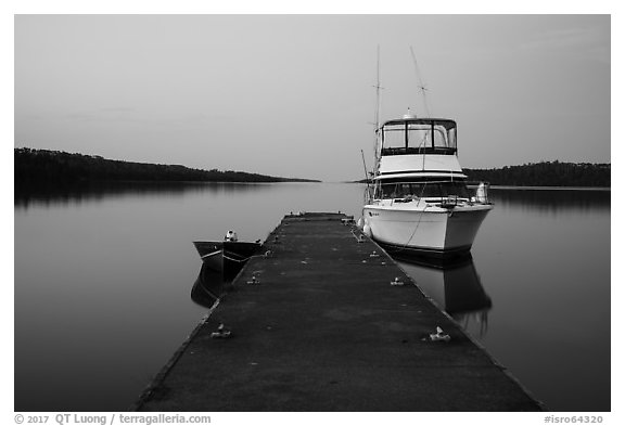 Dock with motorboat and yacht at dusk, Moskey Basin. Isle Royale National Park (black and white)