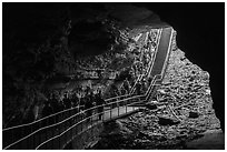 Many visitors waking into cave through historic entrance. Mammoth Cave National Park ( black and white)