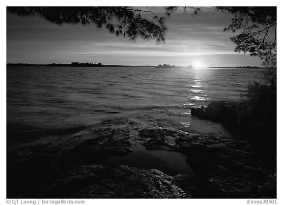 Sun rising on Kabetogama lake. Voyageurs National Park (black and white)