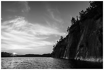 Sun setting and Grassy Bay Cliffs at sunset. Voyageurs National Park ( black and white)
