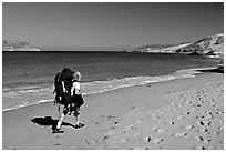 Backpacker on beach, Cuyler harbor, San Miguel Island. Channel Islands National Park, California, USA. (black and white)