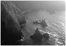 Cliffs and pointed rocks, Cathedral Cove, late afternoon, Anacapa Island. Channel Islands National Park, California, USA. (black and white)