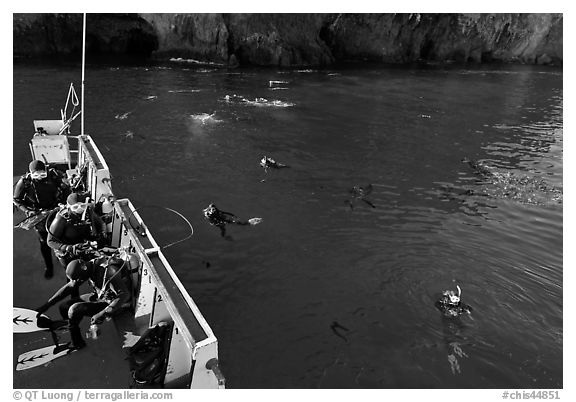 Diving boat and scuba divers in water, Annacapa. Channel Islands National Park (black and white)