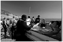 Divers in hot tub aboard the Spectre dive boat, Santa Cruz Island. Channel Islands National Park, California, USA. (black and white)
