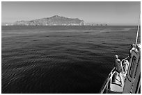 Woman on boat cruising towards Annacapa Island. Channel Islands National Park, California, USA. (black and white)