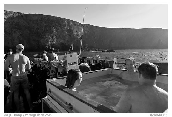 Divers relaxing in hot tub aboard the Spectre and Annacapa Island. Channel Islands National Park, California, USA.