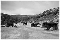 Tents pitched in wind shelters, Santa Rosa Island. Channel Islands National Park ( black and white)