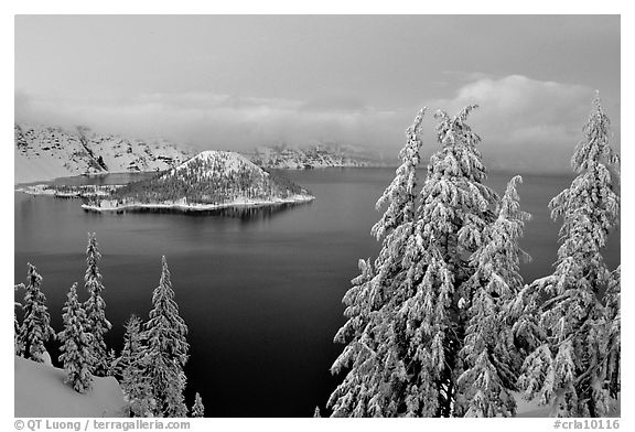 Wizard Island and Lake at dusk in winter. Crater Lake National Park, Oregon, USA.