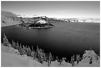 Wizard Island and lake in late afternoon shade, winter. Crater Lake National Park, Oregon, USA. (black and white)