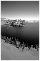 Wizard Island and lake in winter, late afternoon. Crater Lake National Park, Oregon, USA. (black and white)