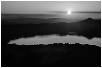 Crater Lake with setting sun from Mount Scott. Crater Lake National Park ( black and white)