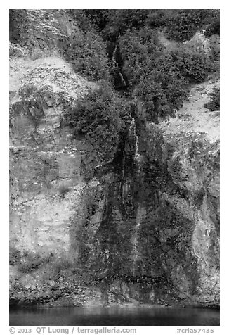 Chaski Slide waterfall flowing into lake. Crater Lake National Park (black and white)