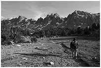 Backpackers walking on trail in meadow towards mountains. Kings Canyon National Park ( black and white)