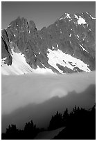 Peaks above fog-filled Cascade River Valley, early morning, North Cascades National Park. Washington, USA. (black and white)