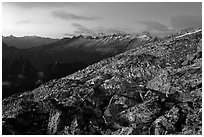 Rocky slope and distant range at dusk, North Cascades National Park.  ( black and white)