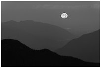 Moon setting over ridges, North Cascades National Park. Washington, USA. (black and white)