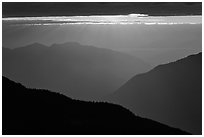 Layered ridges with sun behind clouds, North Cascades National Park. Washington, USA. (black and white)