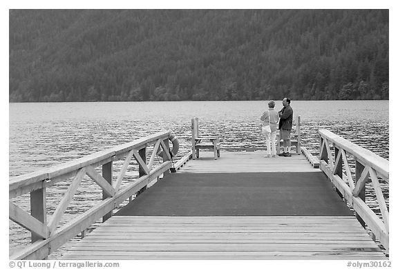 Couple on Pier, Crescent Lake. Olympic National Park, Washington, USA.