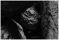Dark passage with wedged boulder, Balconies Cave. Pinnacles National Park, California, USA. (black and white)