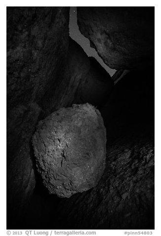 Boulder in Balconies talus cave at night. Pinnacles National Park (black and white)