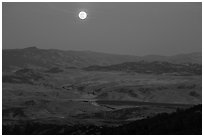 Moon and distant hills from North Chalone Peak. Pinnacles National Park, California, USA. (black and white)