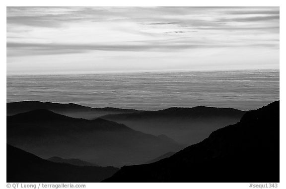 Receding lines of  foothills and sea of clouds at sunset. Sequoia National Park, California, USA.