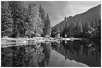 Merced River with fall colors and Sentinel Rocks reflections. Yosemite National Park, California, USA. (black and white)