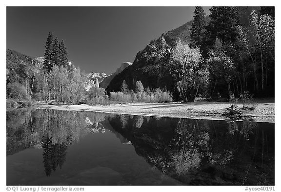 Banks of  Merced River with Half-Dome reflections in autumn. Yosemite National Park, California, USA.