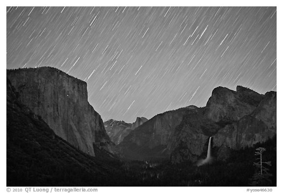 Yosemite Valley by night with star trails. Yosemite National Park (black and white)