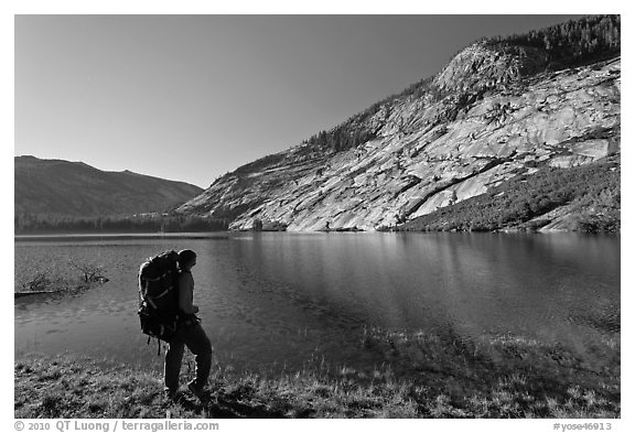 Park visitor with backpack looking, Merced Lake, morning. Yosemite National Park (black and white)