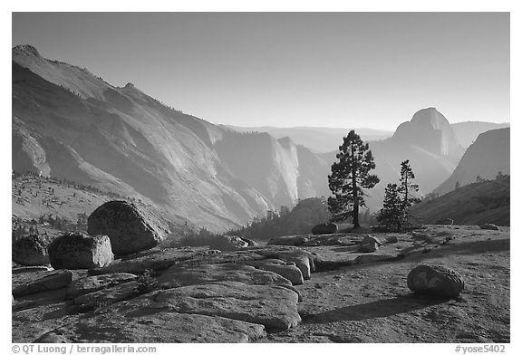 Erratic boulders, pines, Clouds rest and Half-Dome from Olmstedt Point, late afternoon. Yosemite National Park (black and white)
