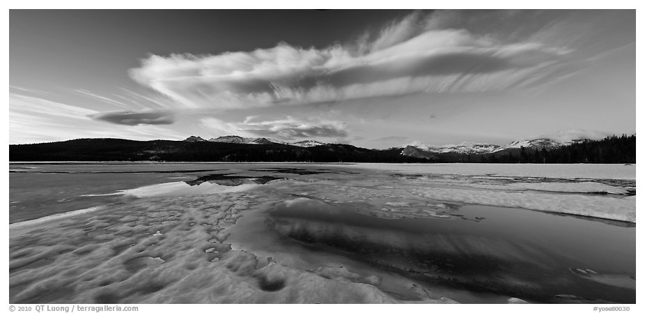 Snow-covered Twolumne Meadows and big cloud at sunset. Yosemite National Park (black and white)