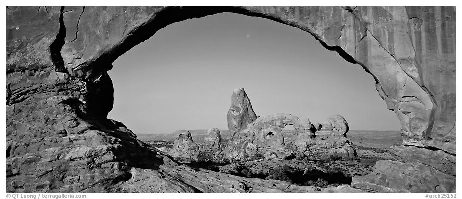 Turret Arch through slickrock window. Arches National Park (black and white)
