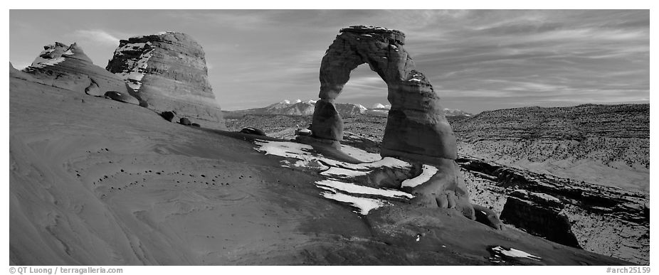 Desert Arch and mountains at sunset. Arches National Park (black and white)