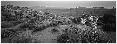 Fiery Furnace sandstone fins and mountains at dusk. Arches National Park (Panoramic black and white)