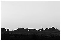 Windows Group backlit at sunrise. Arches National Park, Utah, USA. (black and white)