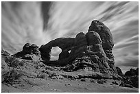 Turret Arch at night, lit by moon. Arches National Park, Utah, USA. (black and white)