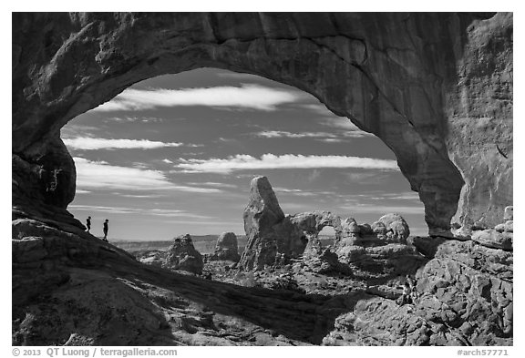 Family in the North Window span. Arches National Park (black and white)