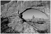 Turret Arch seen through South Window, early morning. Arches National Park, Utah, USA. (black and white)