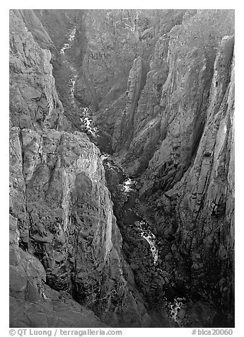 View down steep rock walls and narrow chasm. Black Canyon of the Gunnison National Park (black and white)