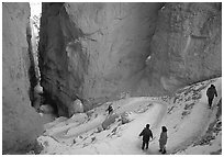 Hikers descending trail in Wall Street Gorge. Bryce Canyon National Park, Utah, USA. (black and white)