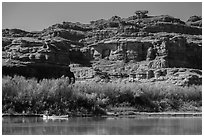 Canoeists and cliffs, Colorado River. Canyonlands National Park, Utah, USA. (black and white)