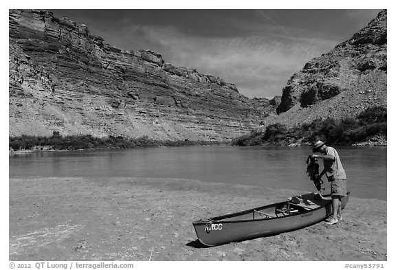 Canoeist and canoe near Confluence. Canyonlands National Park, Utah, USA.