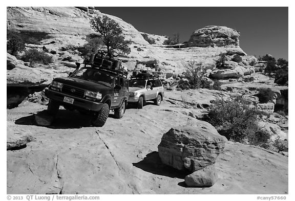 Vehicles on ledge in Teapot Canyon. Canyonlands National Park (black and white)