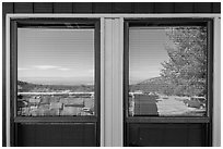 Parking lot and Basin open view, visitor center window reflexion. Great Basin National Park, Nevada, USA. (black and white)