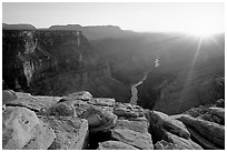 Cracked rocks and Colorado River at Toroweap, sunset. Grand Canyon National Park, Arizona, USA. (black and white)