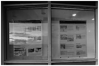 Sunset and attractions listings, Far View visitor center window reflexion. Mesa Verde National Park, Colorado, USA. (black and white)