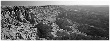 Badlands carved into prairie by erosion. Badlands National Park (Panoramic black and white)